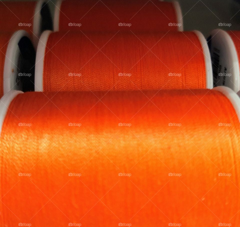 Orange Spools of Thread
