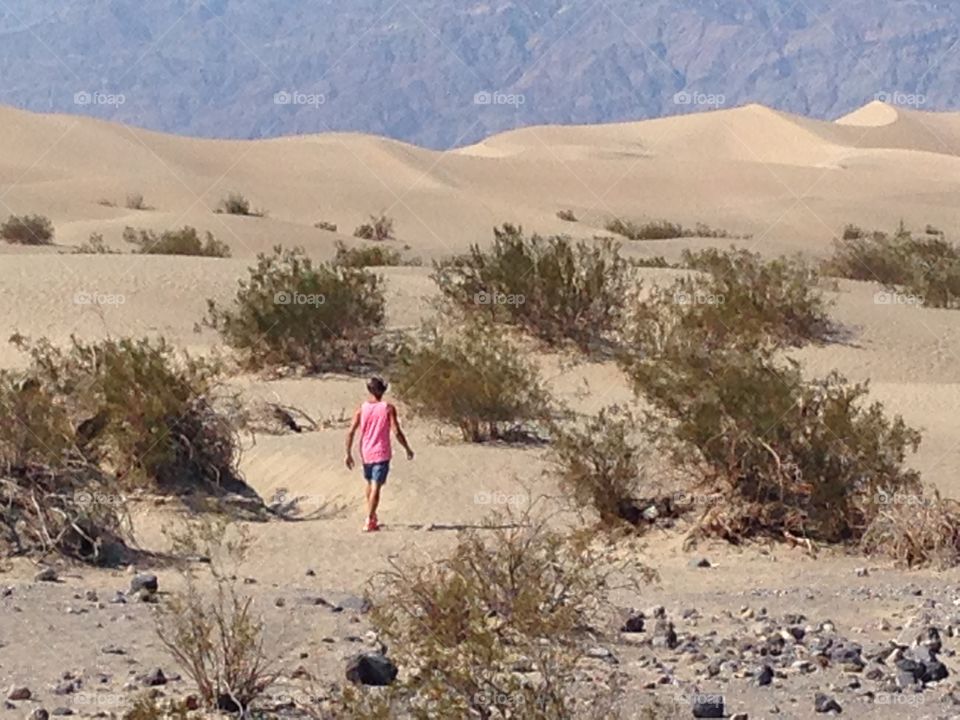 Man in the Desert between the dunes 