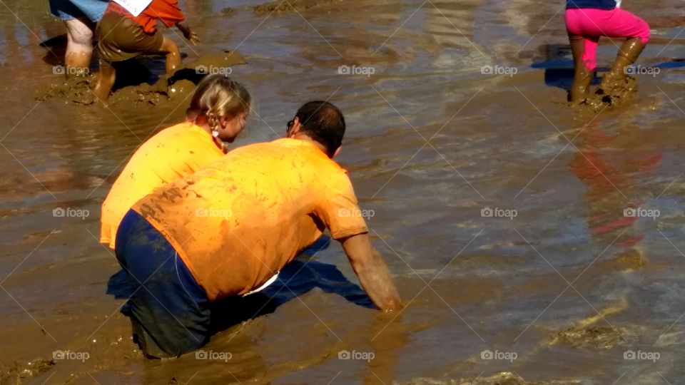 Trudging through the mud pit during the Marine Mud Run