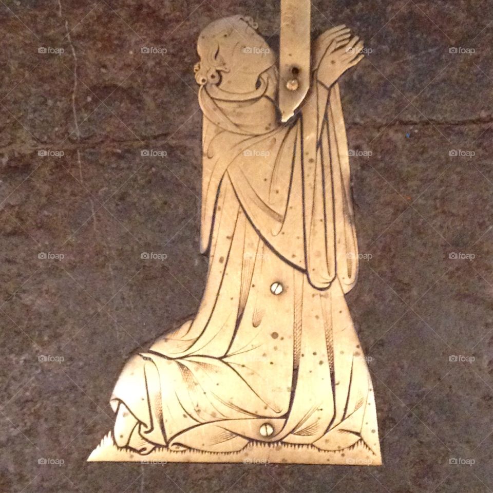 A medieval brass memorial to a man who appears to have been a monk, taken at Ely Cathedral in Cambridgeshire.