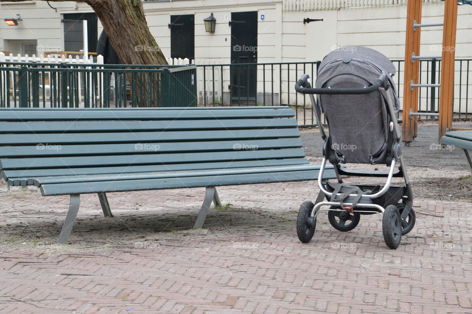 Empty Bench With Baby Buggy