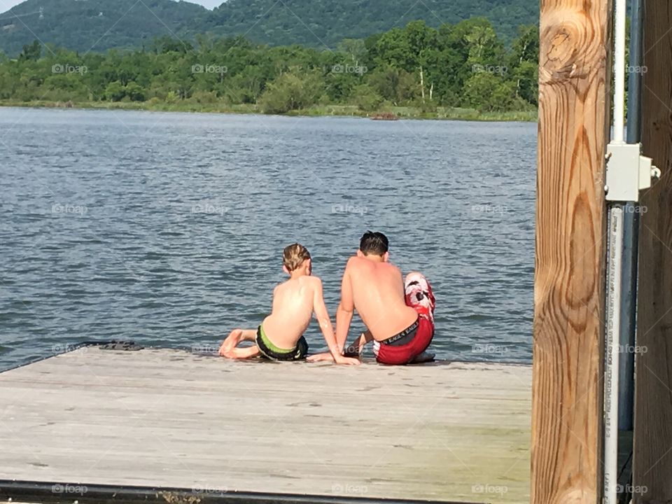 Friends talking at the lake