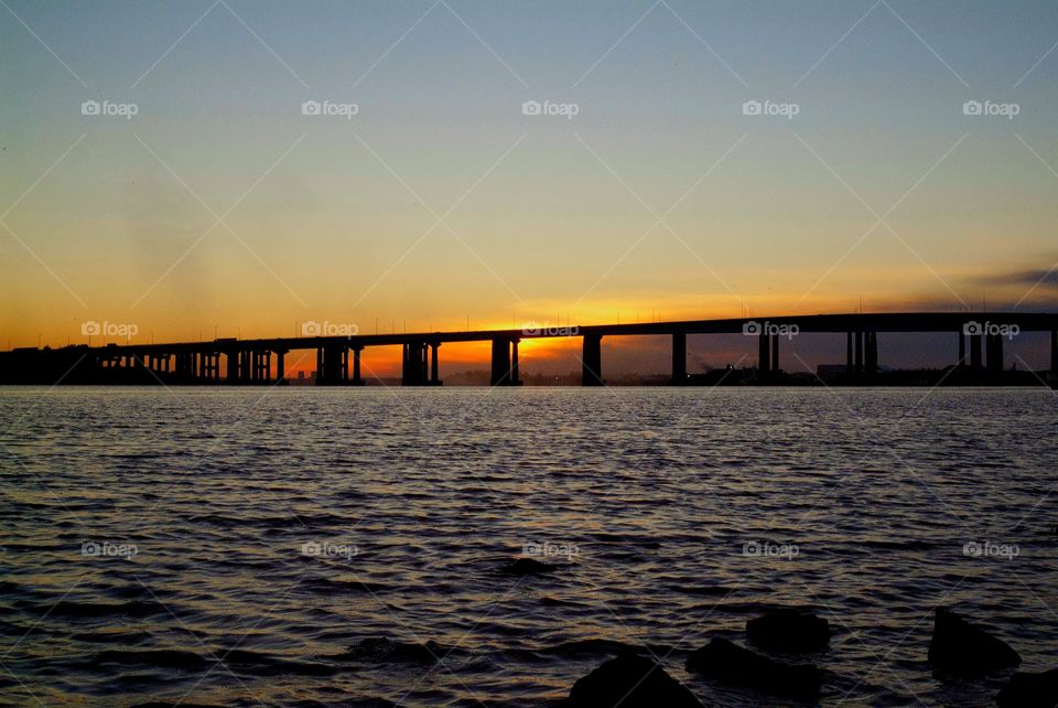 A beautiful fiery sunset descends in the distant skies off the Raritan bay of Perth Amboy, New jersey.