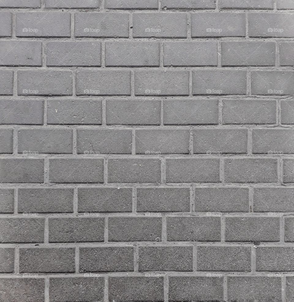Grey brick wall as background