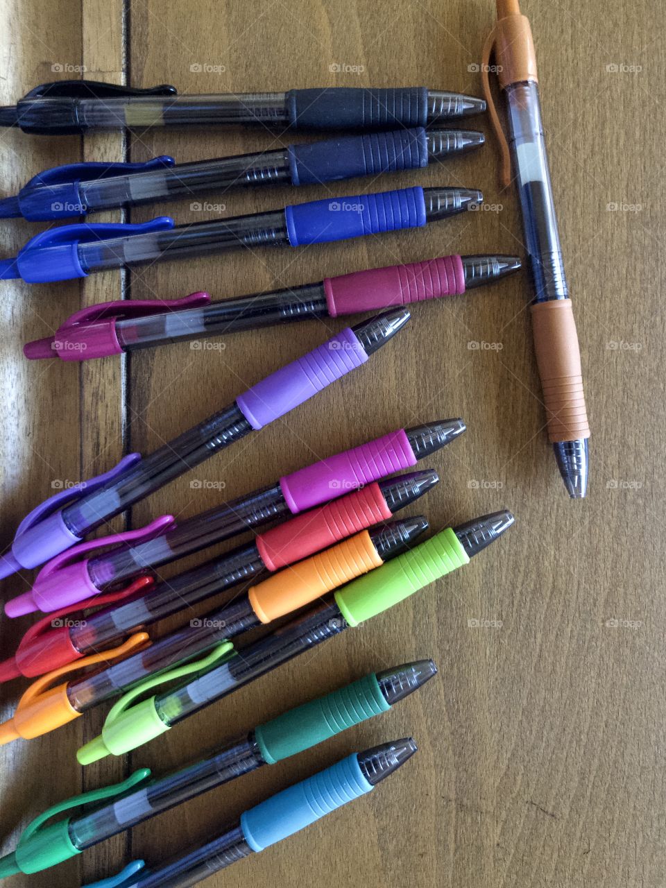 Colorful pens on drafting table 