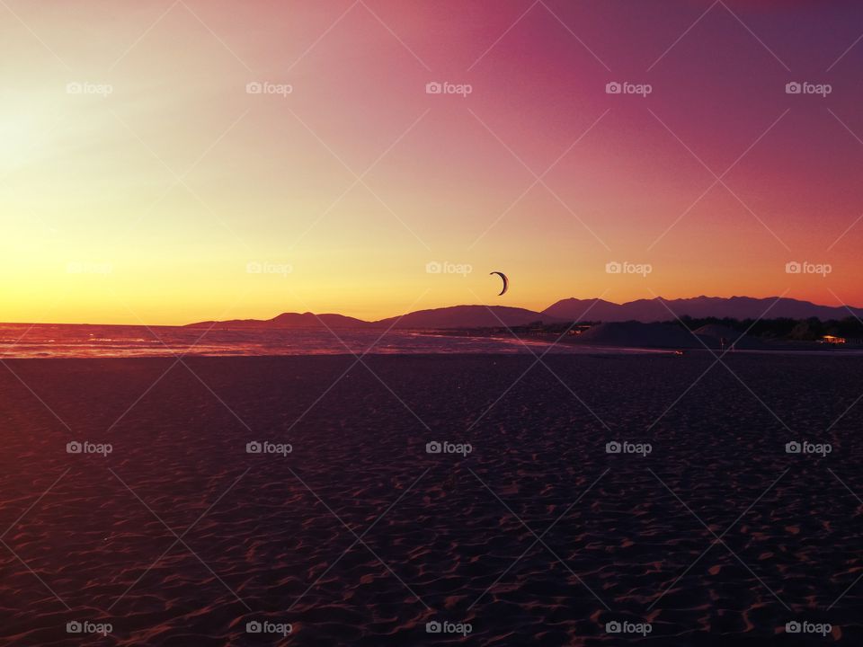 amazing sandy beach, sunset, sea and mountains