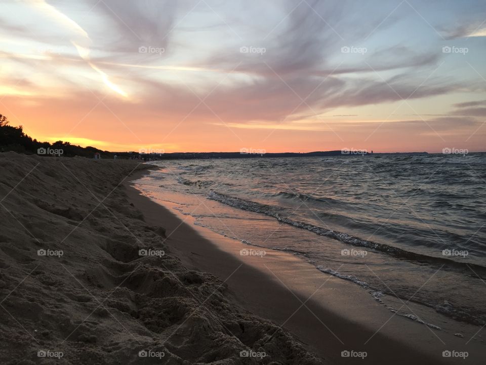 Scenic view of sea against dramatic sky