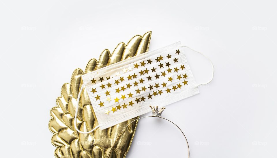 New normal. Face mask with stars. Golden wings, face mask with stars and little crown