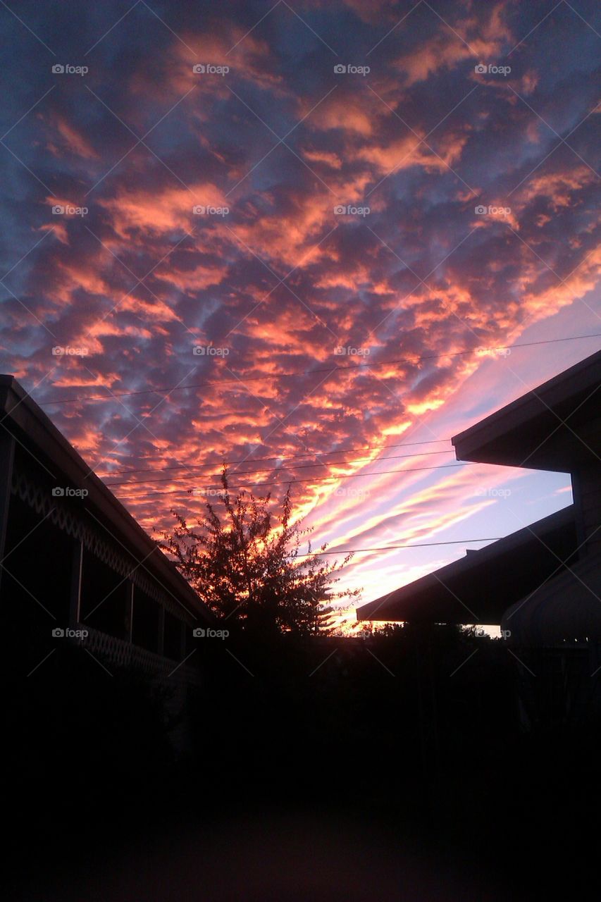 A gorgeous pink and orange sunset reflecting off the clouds to create an awesome effect.