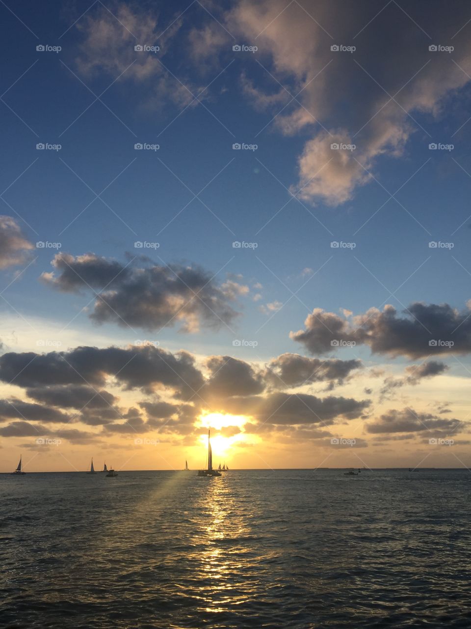 Sunset and sailboats from a ship in Key West, Florida, USA