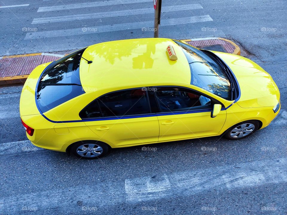 yellow taxi photographed from above