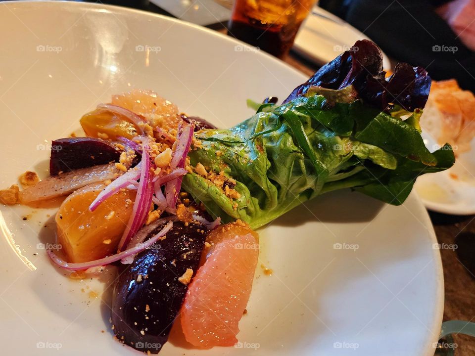 Fancy decorative salad with grapefruit  red and yellow beets.