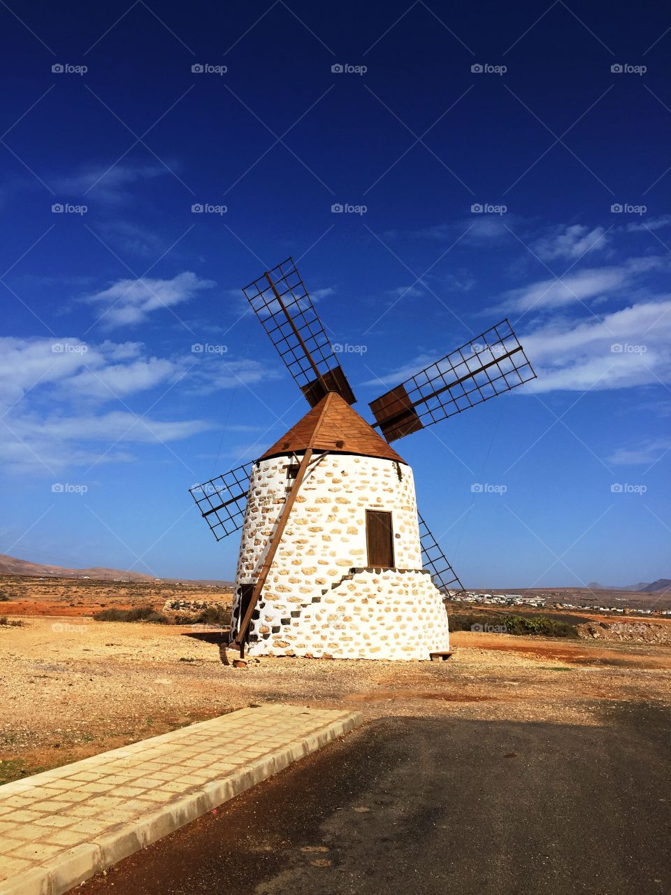 a wind mill  old and disused ,but in working order