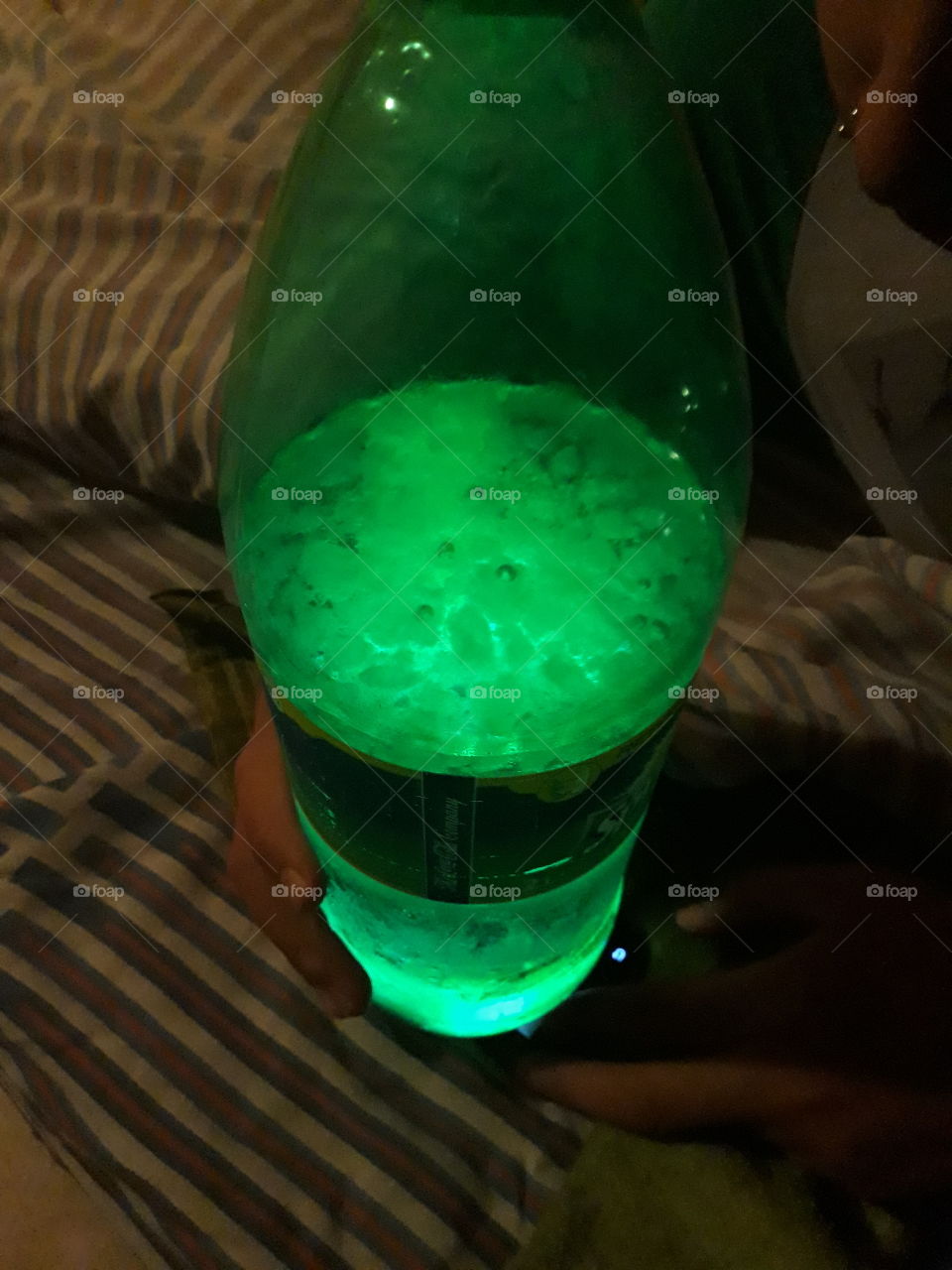 A bottle with light and ice is the perfect combination to shine