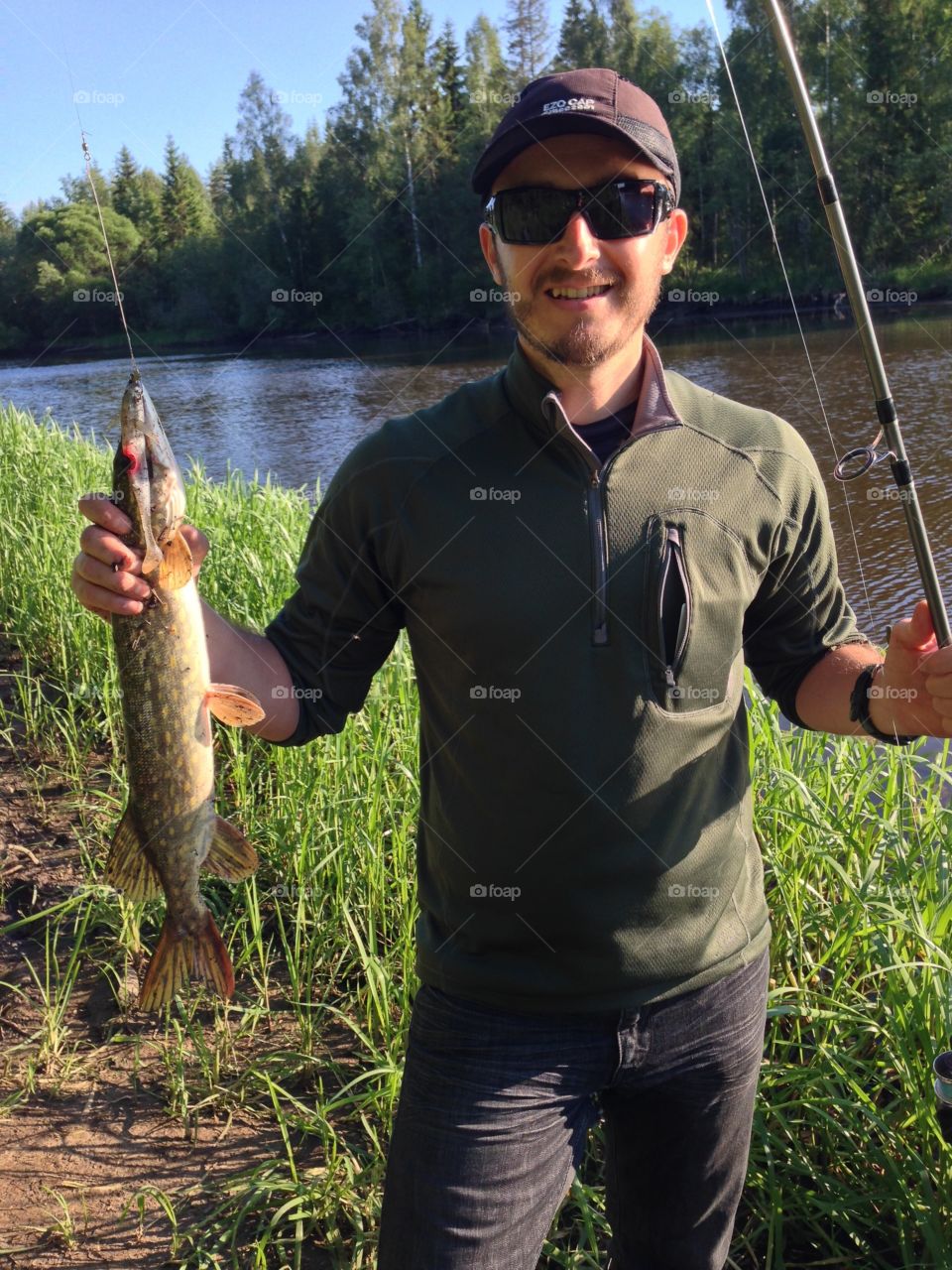 Successful fisherman . Fisherman that caught a pike 