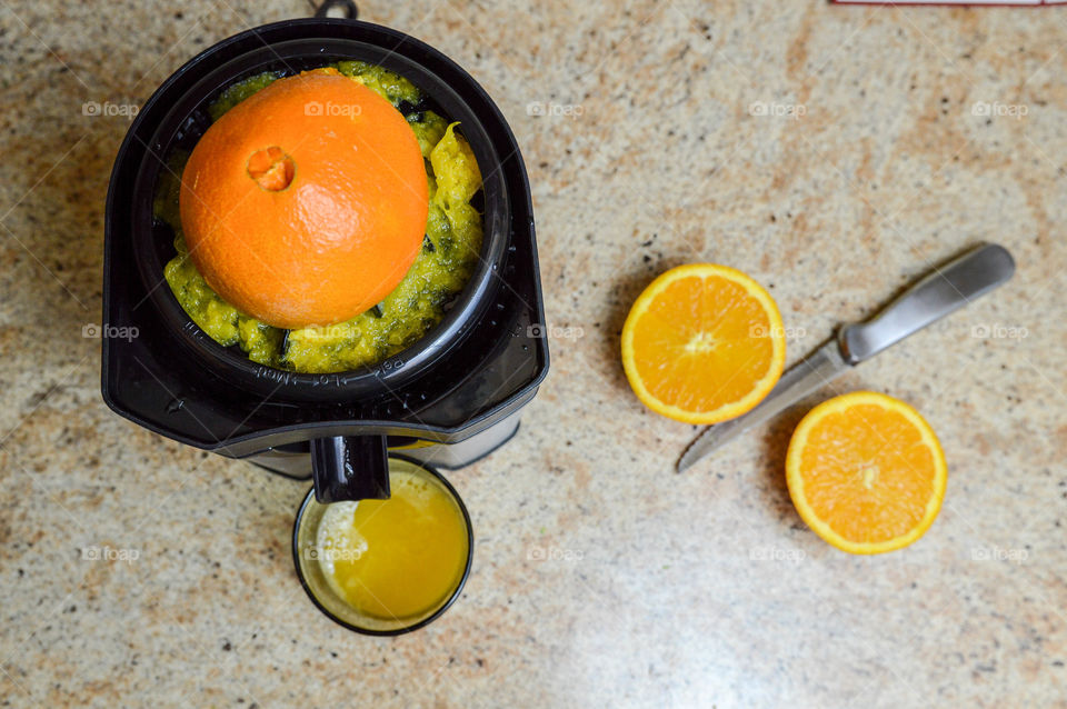 Freshly squeezed orange juice and juicer