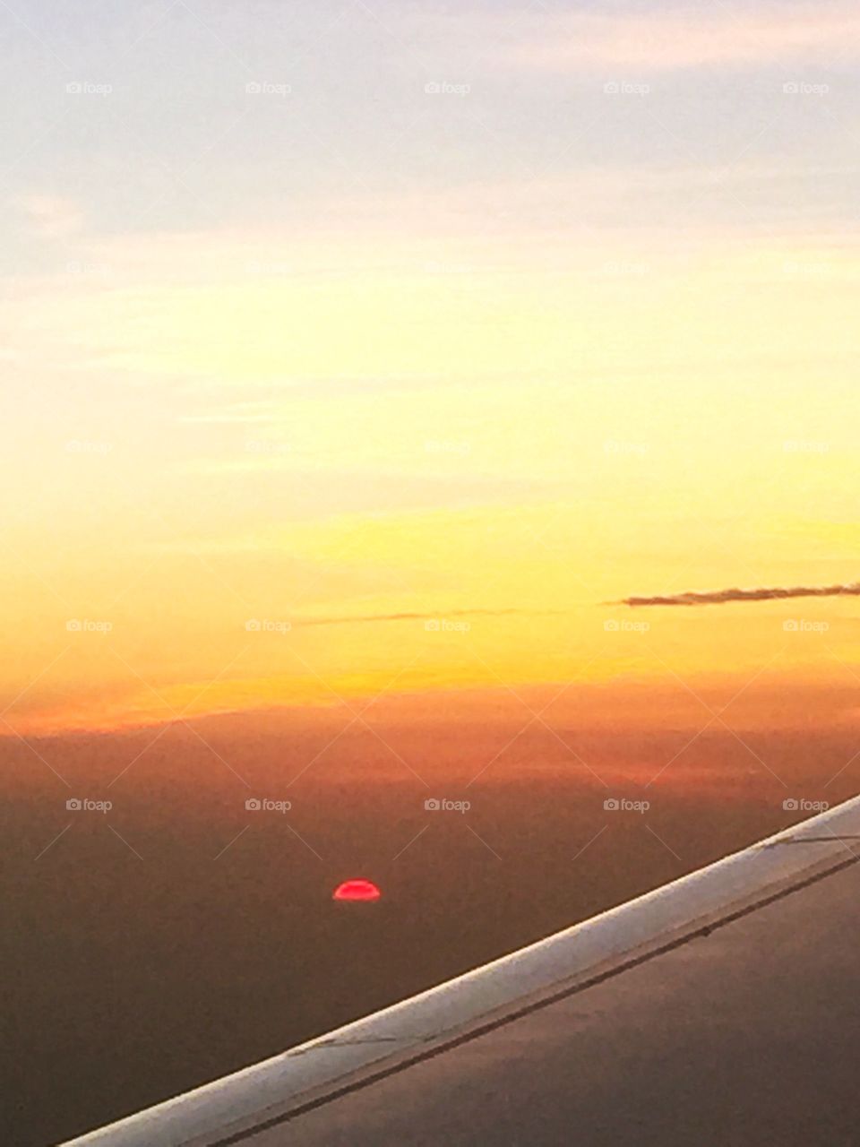 Red Sun Setting . Sunset View from Airplane