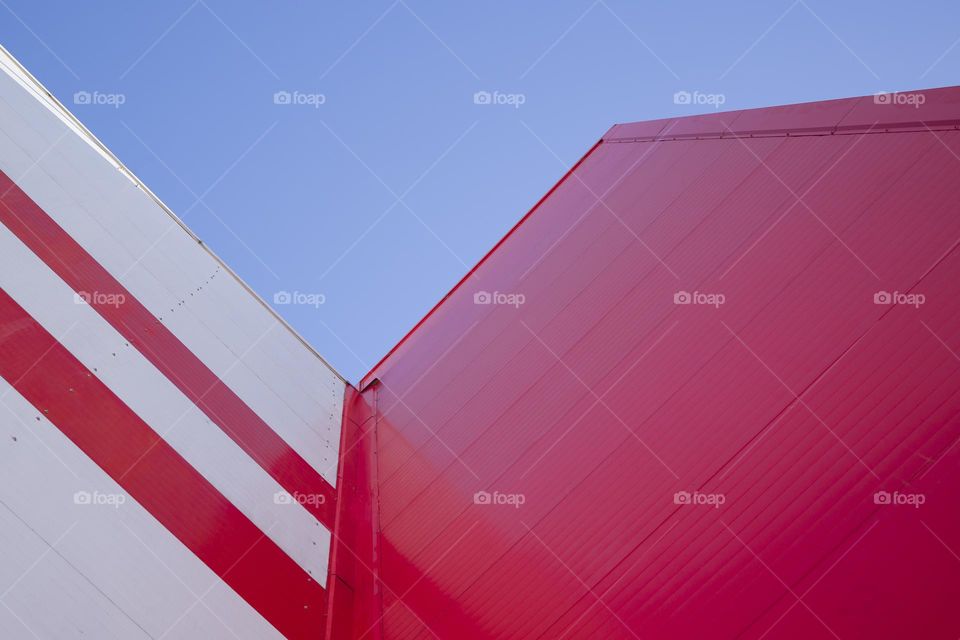 Low Angle View Of  Modern Office Building with Red Facade .