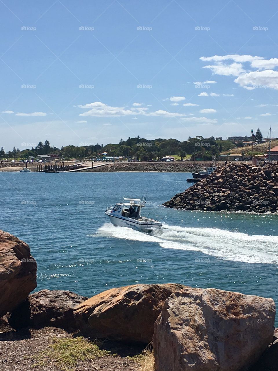 Speedboat returning to harbour outdoor ocean marina 
