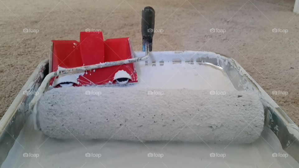 Red paint edger and roller in metal tin with white paint