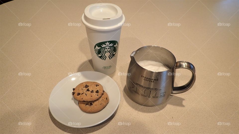 Ready to go outside with my freshly made Starbucks coffee capuchino and chocolate chips cookies
