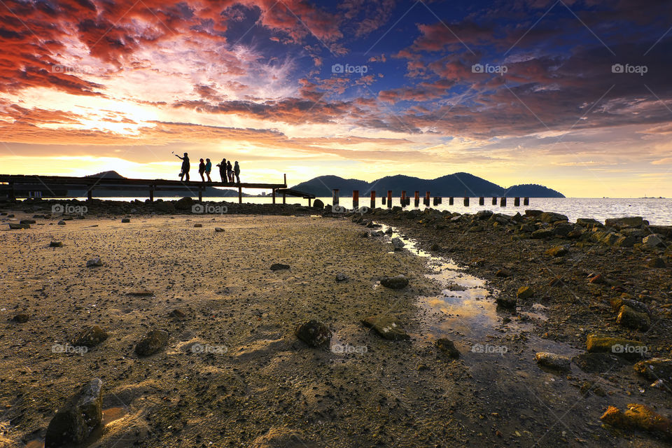 Dramatic sunset sky with jetty background in Marina Island