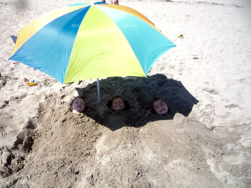 Under the beach umbrella 