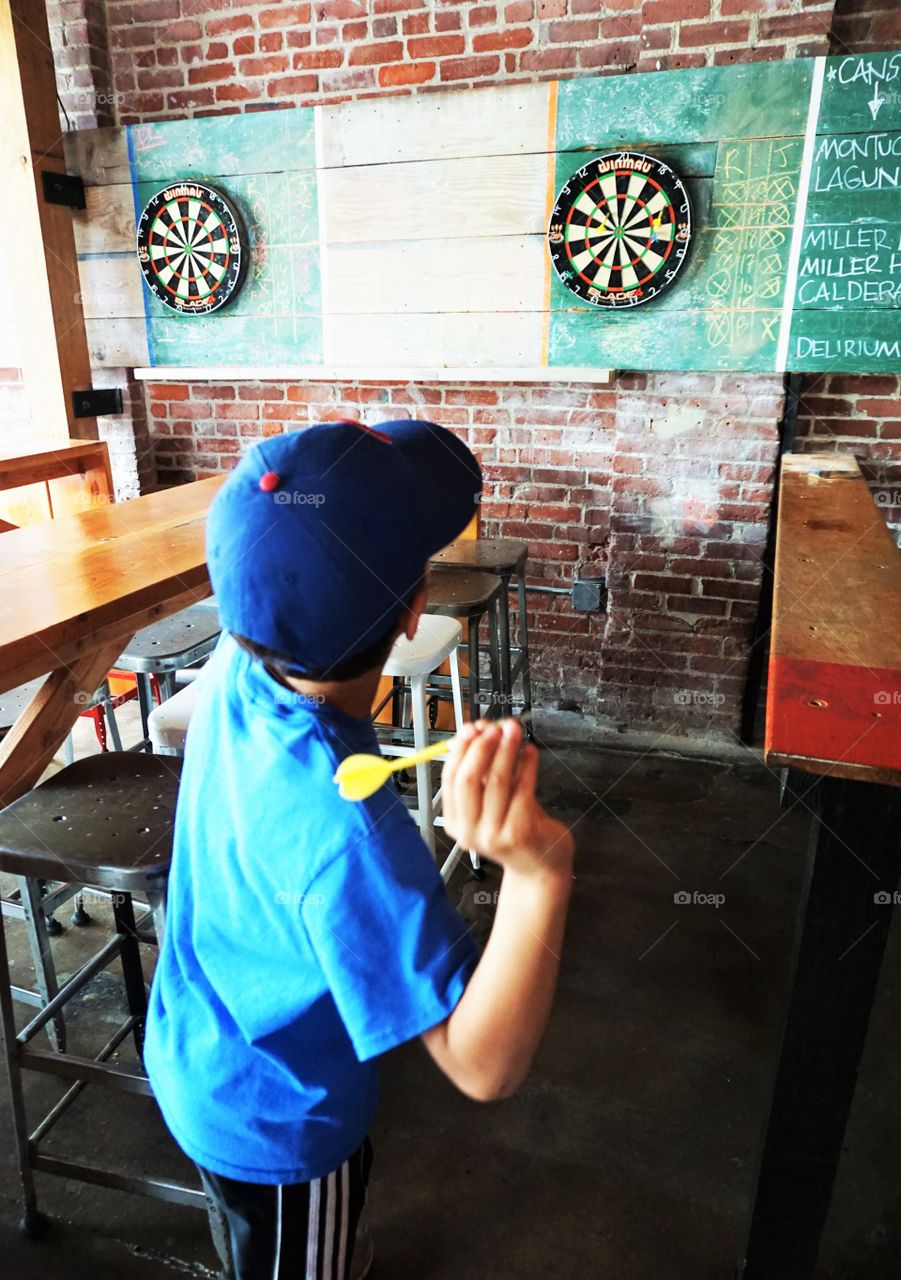 never too young. darts and sports bars