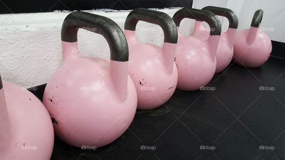 Close-up of pink kettlebells