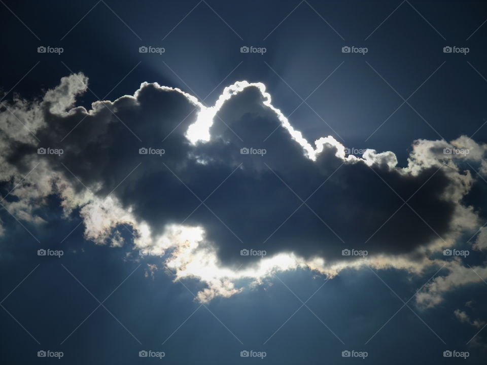 shining through 2. This is a picture of the sun coming through the clouds. 👣 🚶 🏃 🔥 💨