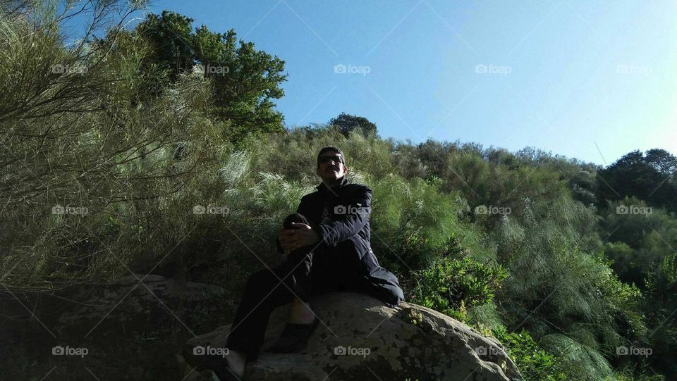 Im feeling relaxed when i sit on a rock between the nature.