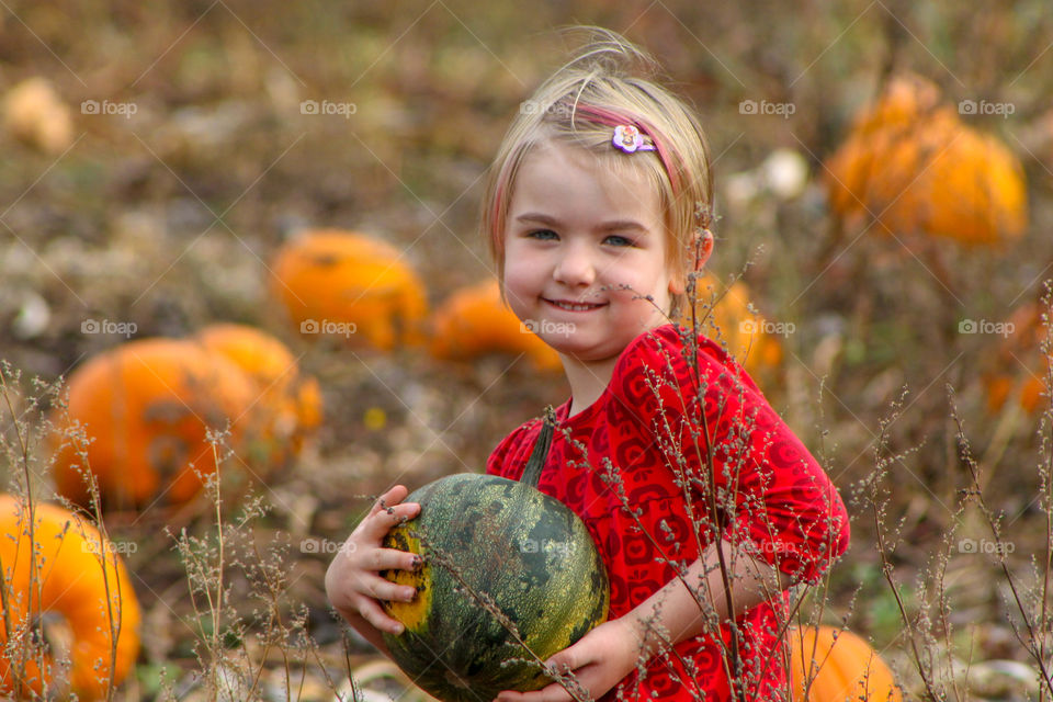 My fav moments are primarily times with my family. This one was taken of my youngest on one of our annual pumpkin patch outings. We all get a small pumpkin to decorate and a big one to carve. She really wanted this green one with an orange dot.
