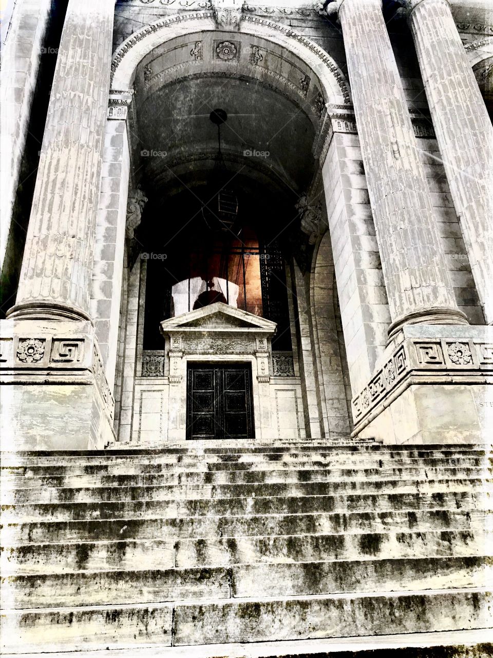 Front view looking up at New York Public library in New York City 