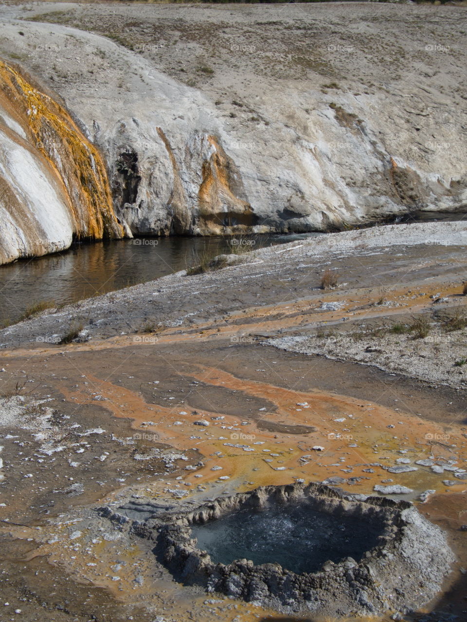 Beautiful, unique, and stunning geology on Geyser Hill in the magnificent Yellowstone National Park on a sunny summer day. 