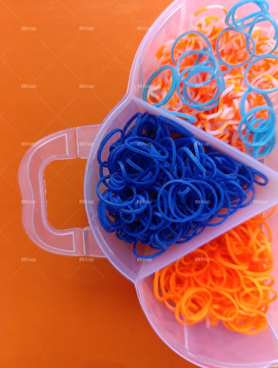 orange and blue rubber bands for weaving.