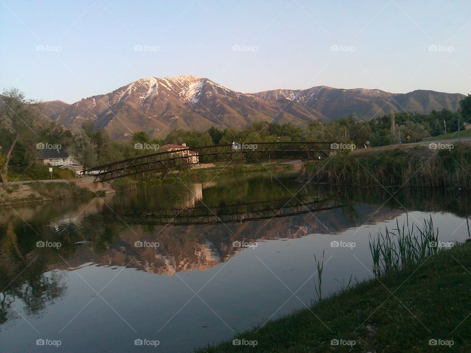 salem pond.  reflection of a bridge over salem pond utah