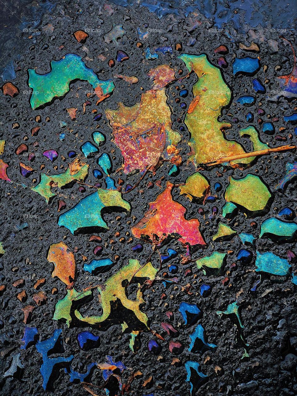 Parking lot pretty, oil and water, beautiful ordinary, colorful spills 