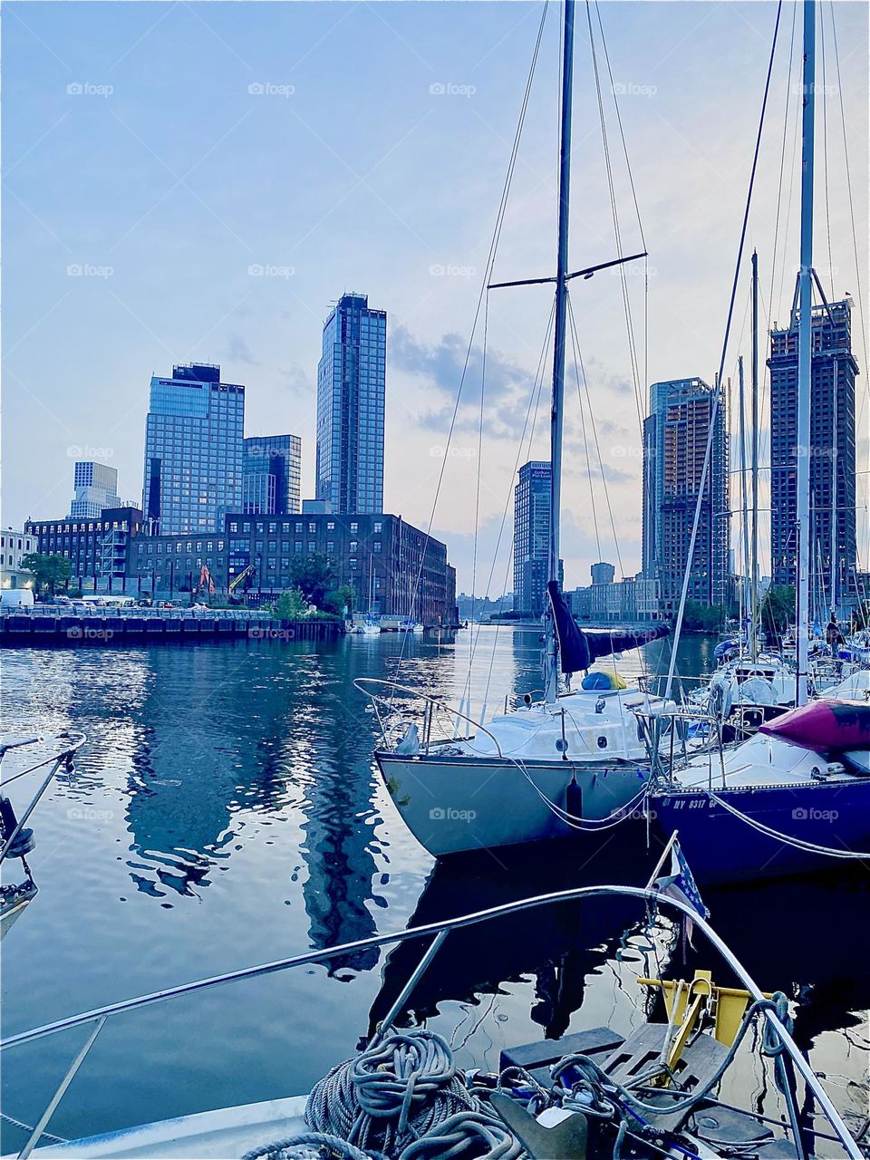 The boats at “Newtown Creek” by the “Pulaski Bridge” in LIC, Queens look particularly enchanting when it’s twilight time and the best views can be experienced from aboard one of them. 2023. Hypnotic Productions