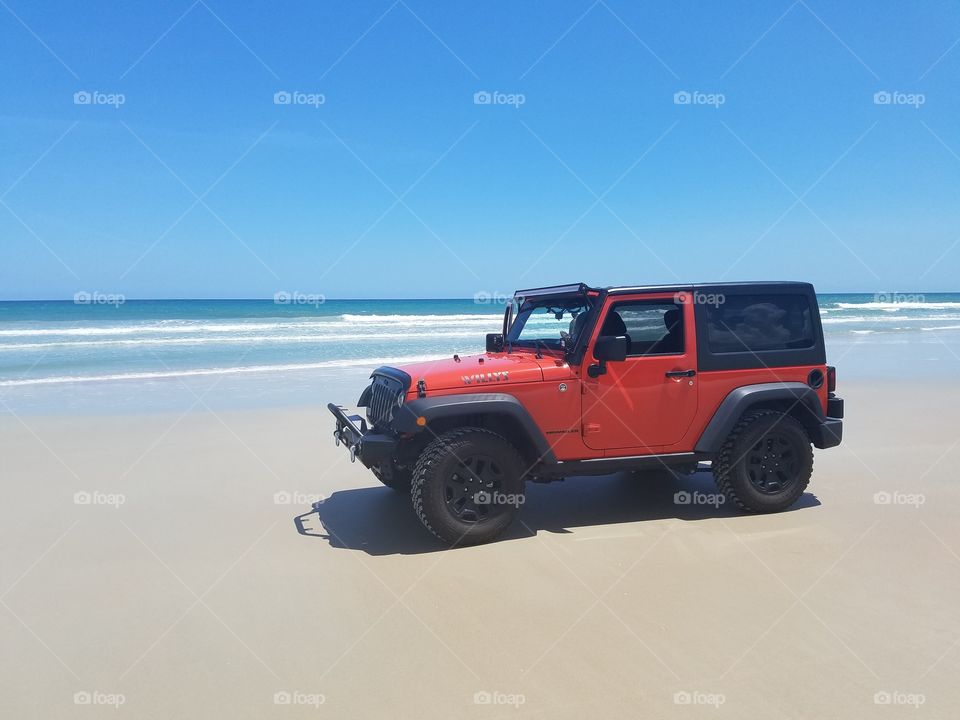 Jeep Wrangler on the beach