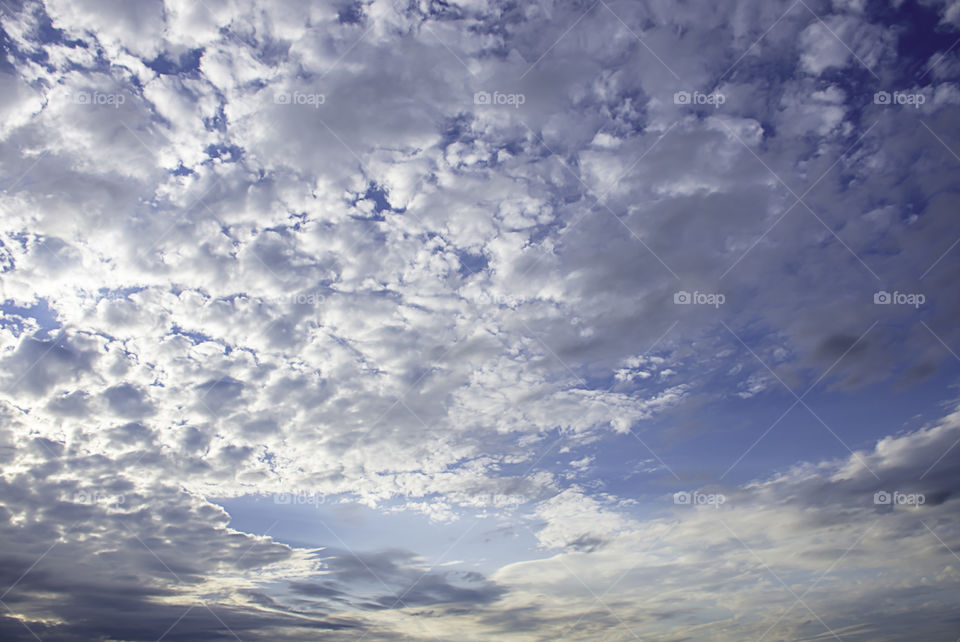 The beauty of the sky with clouds and the sun.