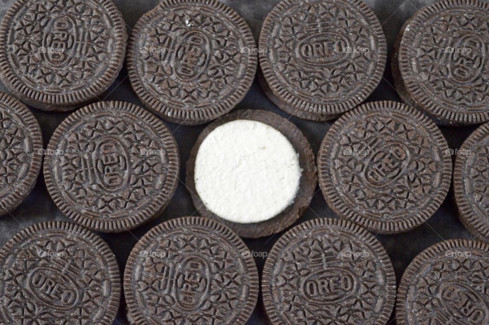 Contrasting Oreo cookies on a black background 