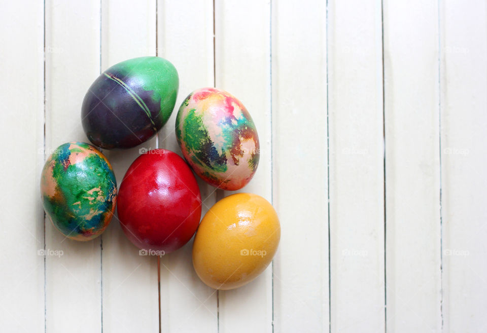 Easter eggs on the wooden background