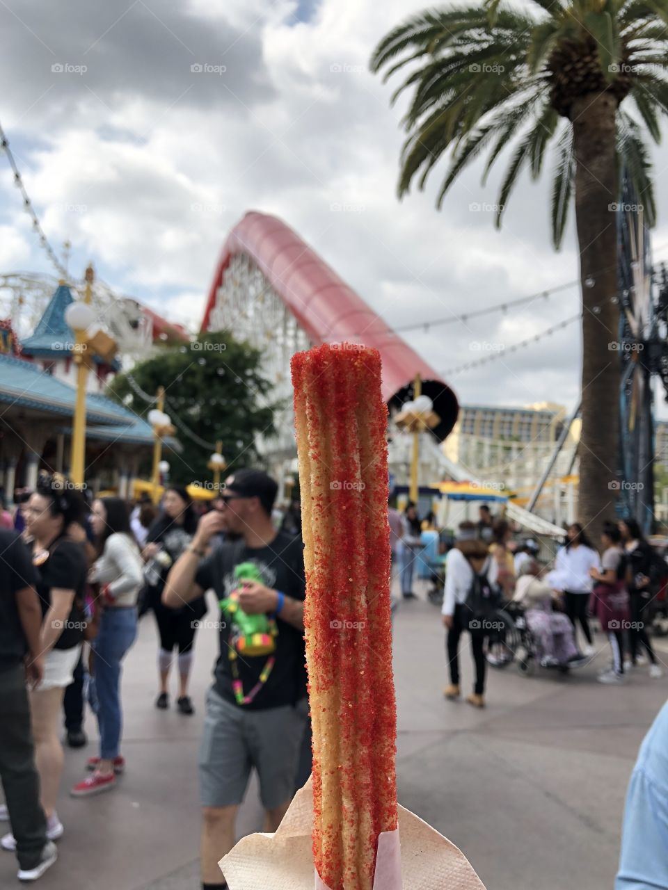 Señor Buzz Caliente Churro at Pixar Pier (California Adventure, Disneyland) in front of the Incredicoaster