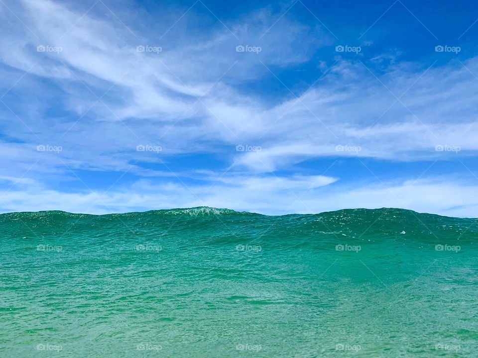 big ocean wave and blue Sky