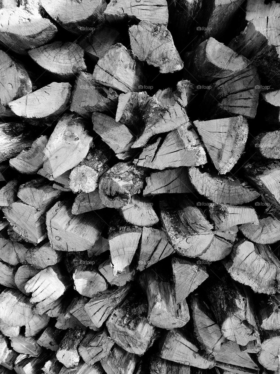 Firewood is stacked neatly awaiting a cold winter night when it will provide warmth as well as a romantic glow for the residents