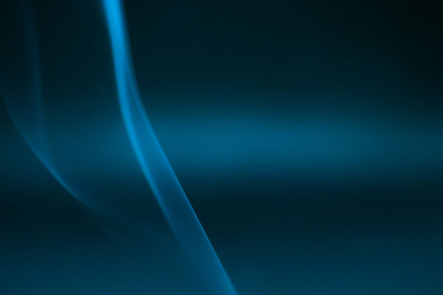 Smoke scented candles on a black background