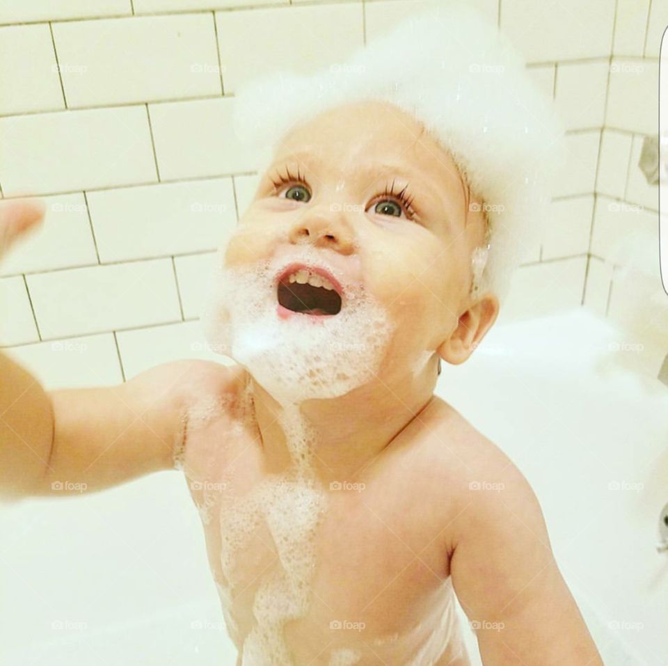 baby enjoying his bath