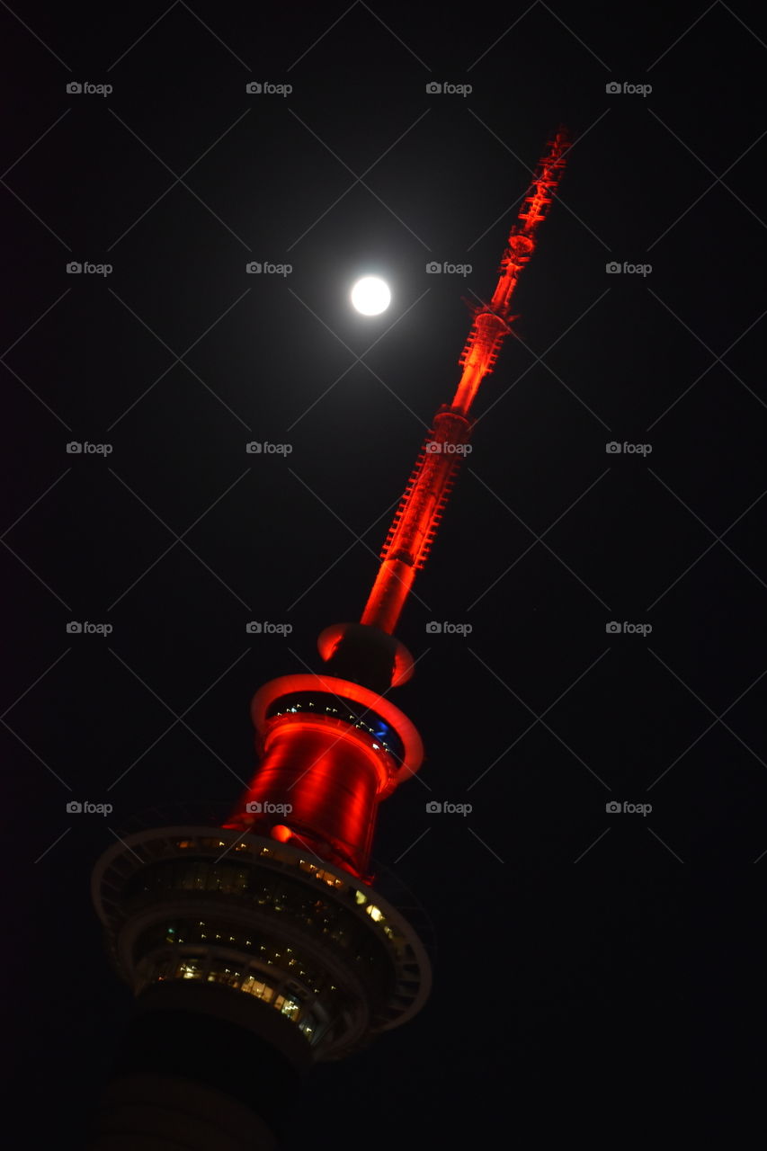 I spent my easter Friday taking photos of the moon behind the Auckland sky tower. The sky tower is red representing Easter
