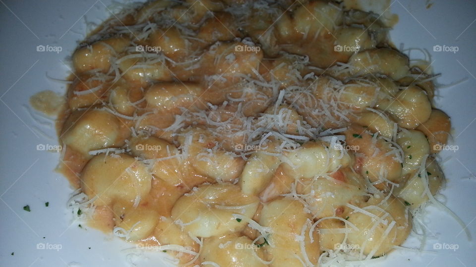 potato gnocchi with pink sauce.