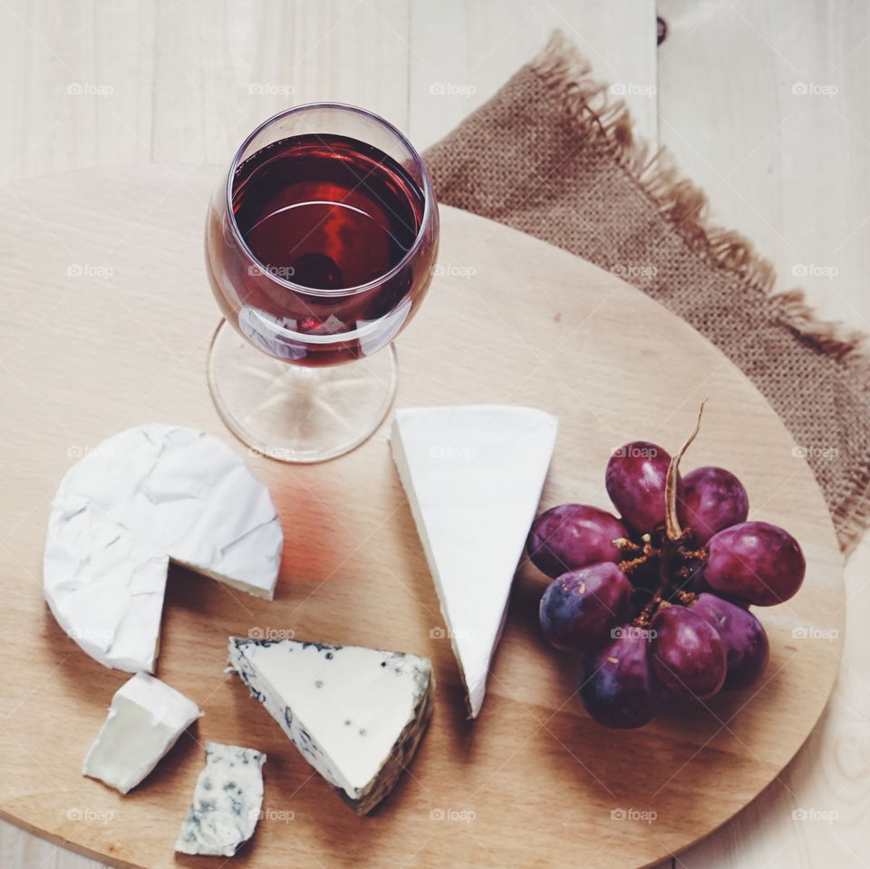 Wine with camembert on cheese board